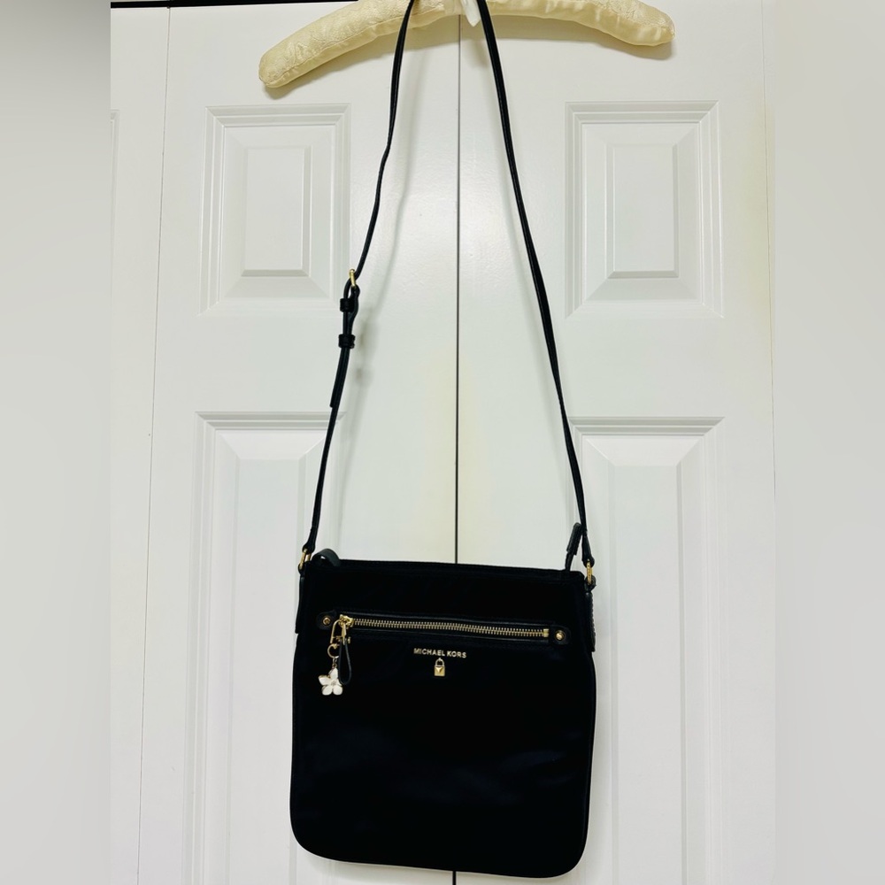 Michael Kors Elegant Black Crossbody Bag with Bag Charm.